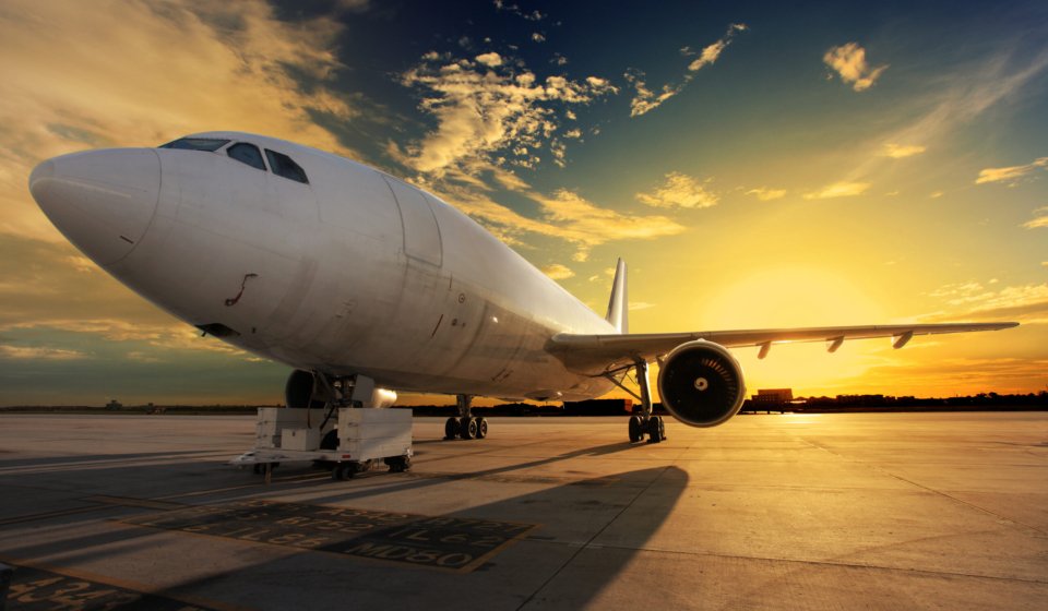 Airplane at sunset - back lit